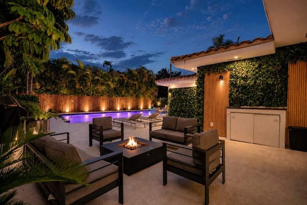 Miami Luxury Access private villa with heated pool and fire pit at dusk