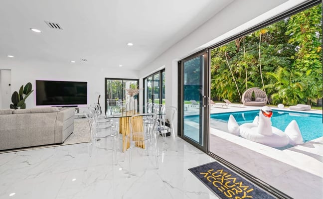 Miami Luxury Access villa living room opening onto the pool